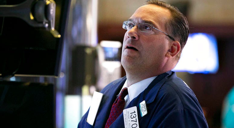Specialist Anthony Matsic works at his post on the floor of the New York Stock Exchange, Monday, Aug. 12, 2019. (AP Photo/Richard Drew)