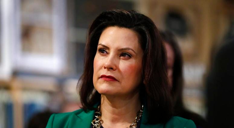 FILE - In this March 18, 2019, file photo, Michigan Gov. Gretchen Whitmer listens to Democratic presidential candidate Sen. Kirsten Gillibrand, D-N.Y., in Clawson, Mich. (AP Photo/Paul Sancya, File) FILE - In this March 18, 2019, file photo, Michigan Gov. Gretchen Whitmer listens to Democratic presidential candidate Sen. Kirsten Gillibrand, D-N.Y., in Clawson, Mich. (AP Photo/Paul Sancya, File)