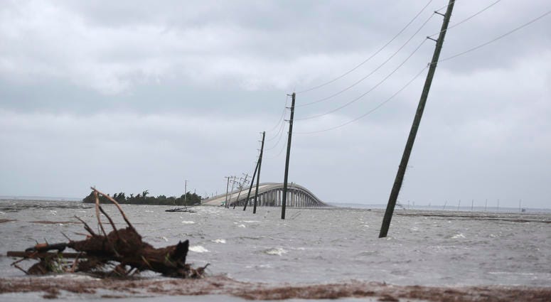 Storm surge from Hurricane Dorian blocks Cedar Island off from the mainland on NC 12 in Atlantic Beach, N.C., after Hurricane Dorian past the coast on Friday, Sept. 6, 2019. (AP Photo/Tom Copeland)