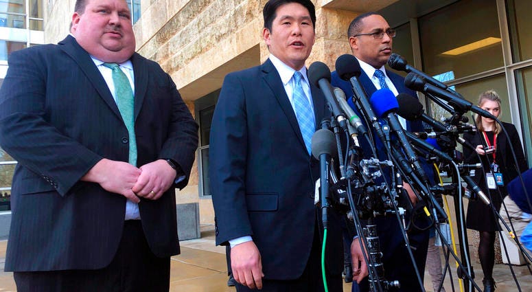 FILE - This Feb. 21, 2019, file photo shows U.S. Attorney Robert Hur, center, of the District of Maryland, speaks as Art Walker, left, special agent from the Coast Guard investigative service, and Gordon Johnson, special agent in charge of the FBI's Balti
