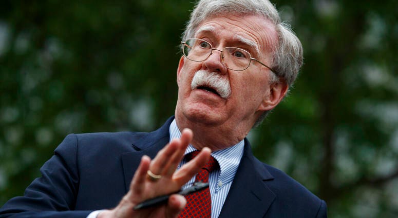 In this May 1, 2019 file photo, National security adviser John Bolton talks to reporters outside the White House in Washington. (AP Photo/Evan Vucci)