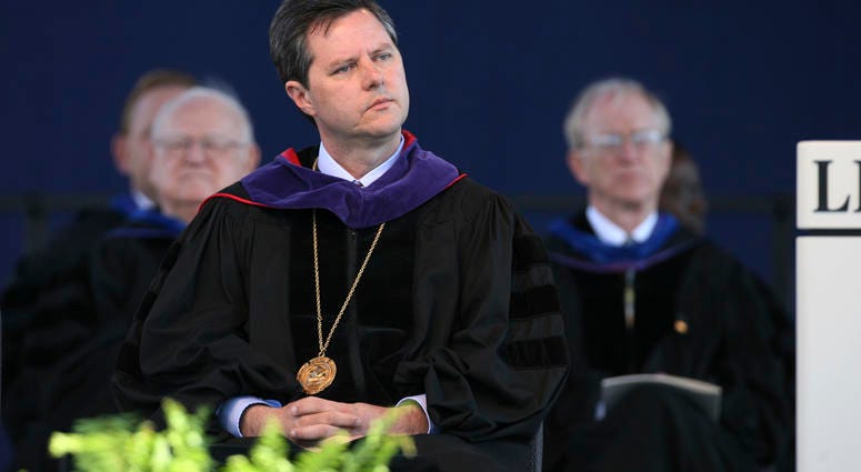 FILE - In this May 19, 2007, file photo, Jerry Falwell, Jr. listens before speaking for the first time as chancellor of Liberty University at the school's graduation ceremony in Lynchburg, Va.