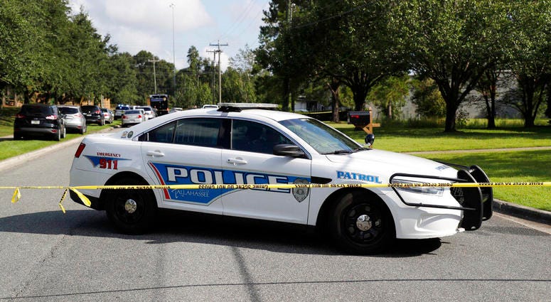 Tallahassee police investigate the scene of multiple stabbings, Wednesday, Sept. 11, 2019 in Tallahassee, Fla. (Tori Schneider/Tallahassee Democrat via AP)