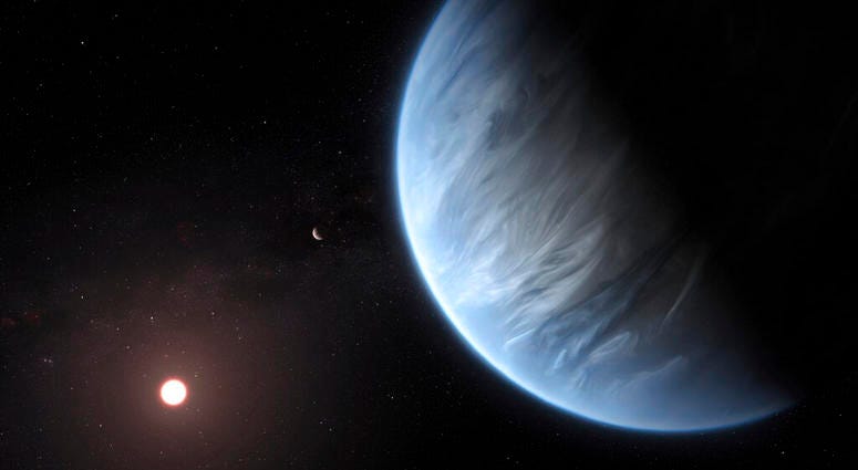 This artist's rendering provided by University College London Centre for Space Exochemistry Data researchers shows Exoplanet K2-18b, foreground, its host star and an accompanying planet in this system.