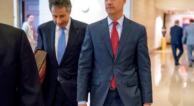 FILE - In this March 8, 2019, file photo, President Donald Trump's former campaign manager Corey Lewandowski, right, and his lawyer Peter Chavkin, left, arrive to meet behind closed doors with the House Intelligence Committee, at the Capitol in Washington