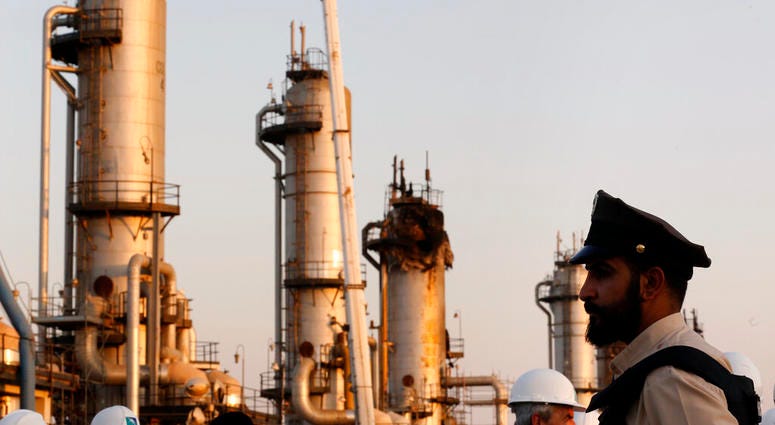 During a trip organized by Saudi information ministry, a security guarder stands alert in front of Aramco's oil processing facility after the recent Sept. 14 attack on Aramco's oil processing facility in Abqaiq, near Dammam in the Kingdom's Eastern Provin