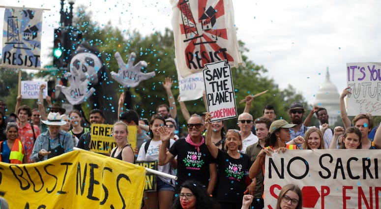 Protesters block traffic near the U.S. Capitol in Washington, Monday, Sept. 23, 2019. A broad coalition of climate and social justice organizations are disrupting the morning rush hour commute. (AP Photo/Pablo Martinez Monsivais) Protesters block traffic near the U.S. Capitol in Washington, Monday, Sept. 23, 2019. A broad coalition of climate and social justice organizations are disrupting the morning rush hour commute. (AP Photo/Pablo Martinez Monsivais)