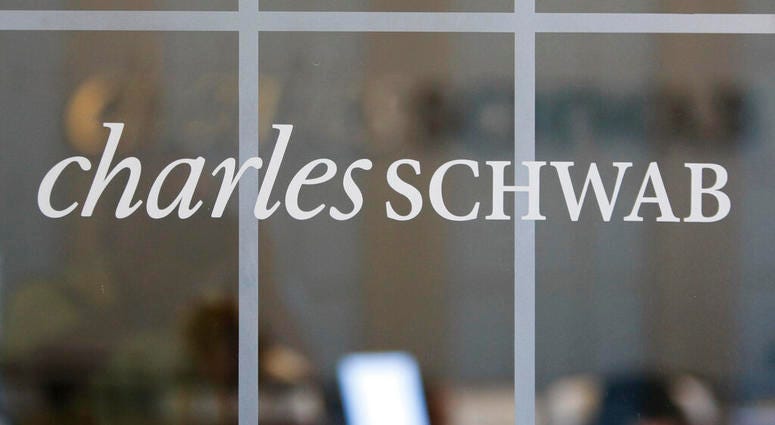 FILE - This July 14, 2010, file photo, shows a Charles Schwab office in Oakland, Calif. Charles Schwab is dropping commissions for online trading of U.S. stocks and exchange-traded funds, the latest slash in an industry battle that’s drastically cut the c