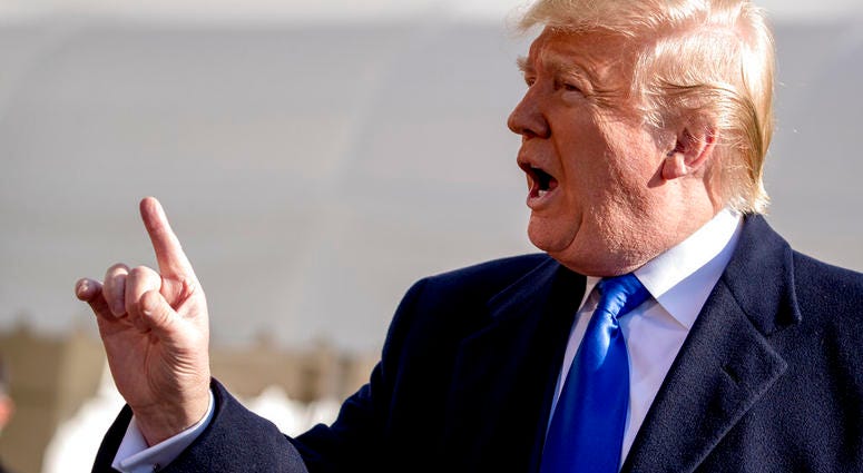 President Donald Trump tells a reporter to be quiet as he speaks on the South Lawn of the White House in Washington, Friday, Nov. 8, 2019, before boarding Marine One. (AP Photo/Andrew Harnik)