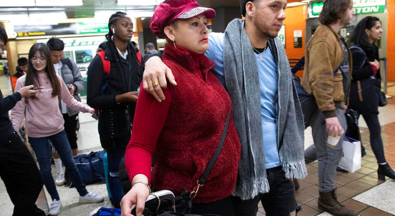 Luz Aurora Vidal and her son, Martín Batalla Vidal, line up to take a bus to Washington, Monday, Nov. 11, 2019, in New York. (AP Photo/Mark Lennihan)