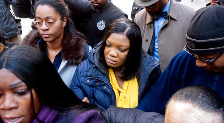Tova Noel, center in yellow blouse, a federal jail guard responsible for monitoring Jeffrey Epstein the night he killed himself, leaves federal court Monday Nov. 25, 2019, in New York. Tova Noel, center in yellow blouse, a federal jail guard responsible for monitoring Jeffrey Epstein the night he killed himself, leaves federal court Monday Nov. 25, 2019, in New York.