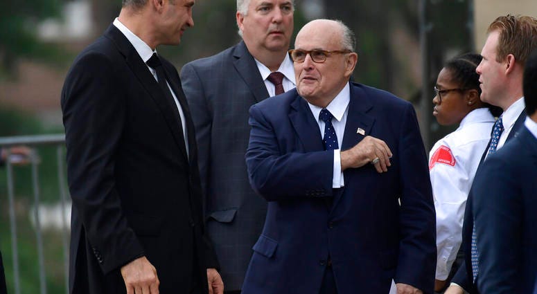 FILE - In this Saturday, Sept. 1, 2018 file photo, President Trump's attorney Rudy Giuliani, center, talks with Ukrainian boxing champ Wladimir Klitschko, left, as they arrive to attend a memorial service for Sen. John McCain, R-Ariz. (AP Photo/Susan Wals FILE - In this Saturday, Sept. 1, 2018 file photo, President Trump's attorney Rudy Giuliani, center, talks with Ukrainian boxing champ Wladimir Klitschko, left, as they arrive to attend a memorial service for Sen. John McCain, R-Ariz. (AP Photo/Susan Wals