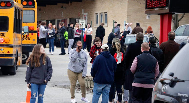 Waukesha South High School students find their waiting parents and friends and hug after they leave the building following shots fired inside the school, Monday, December 2, 2019. (Rick Wood/Milwaukee Journal-Sentinel via AP) Waukesha South High School students find their waiting parents and friends and hug after they leave the building following shots fired inside the school, Monday, December 2, 2019.