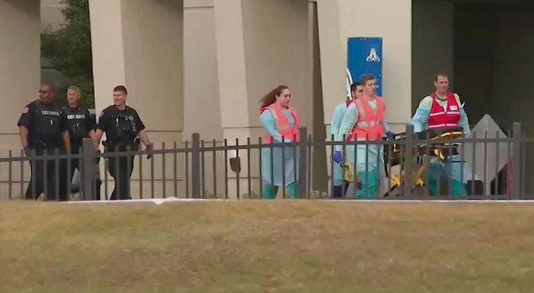 This photo taken from video provided by WEAR-TV shows emergency responders near the Naval Air Base Station in Pensacola, Fla., Friday, Dec. 6, 2019. (WEAR-TV via AP) This photo taken from video provided by WEAR-TV shows emergency responders near the Naval Air Base Station in Pensacola, Fla., Friday, Dec. 6, 2019. (WEAR-TV via AP)
