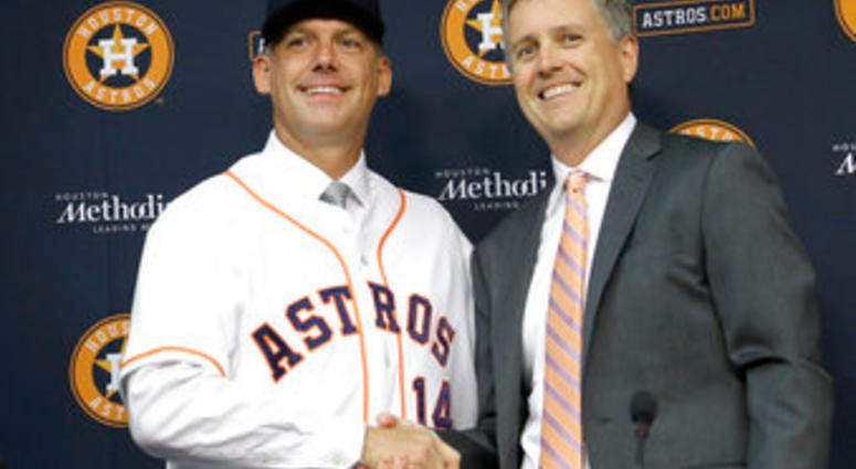 FILE - In this Sept. 29, 2014, file photo, Houston Astros general manager Jeff Luhnow, right, and A.J. Hinch pose after Hinch is introduced as the new manager of the baseball club in Houston. (AP Photo/Pat Sullivan, File) FILE - In this Sept. 29, 2014, file photo, Houston Astros general manager Jeff Luhnow, right, and A.J. Hinch pose after Hinch is introduced as the new manager of the baseball club in Houston. (AP Photo/Pat Sullivan, File)