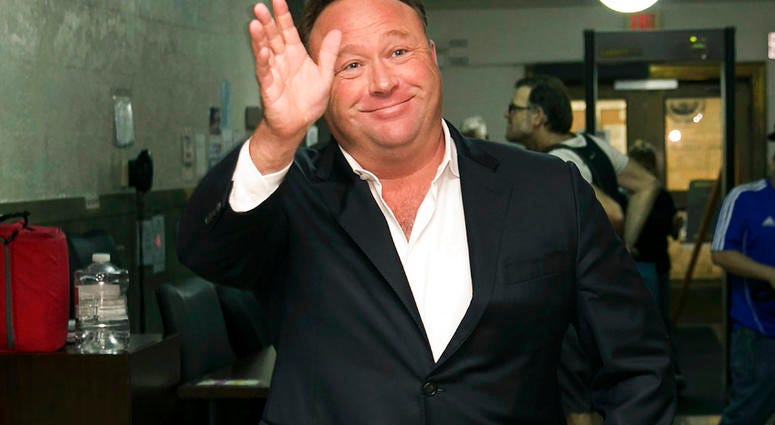FILE - In this April 19, 2017, file photo, Alex Jones, a right-wing radio host and conspiracy theorist, arrives at the courthouse in Austin, Texas. A judge has denied conspiracy theorist Jones' request Wednesday, Aug. 29, 2018, to dismiss a lawsuit surrou
