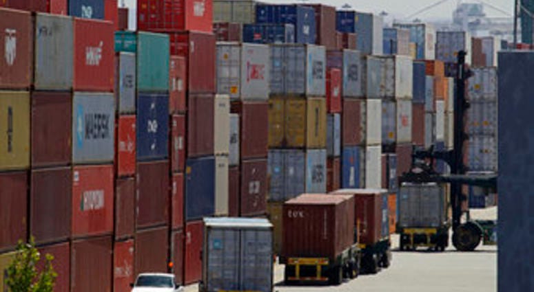 FILE - In this July 22, 2019, file stacked containers wait to be loaded on to trucks at the Port of Oakland in Oakland, Calif. (AP Photo/Ben Margot, File) FILE - In this July 22, 2019, file stacked containers wait to be loaded on to trucks at the Port of Oakland in Oakland, Calif. (AP Photo/Ben Margot, File)
