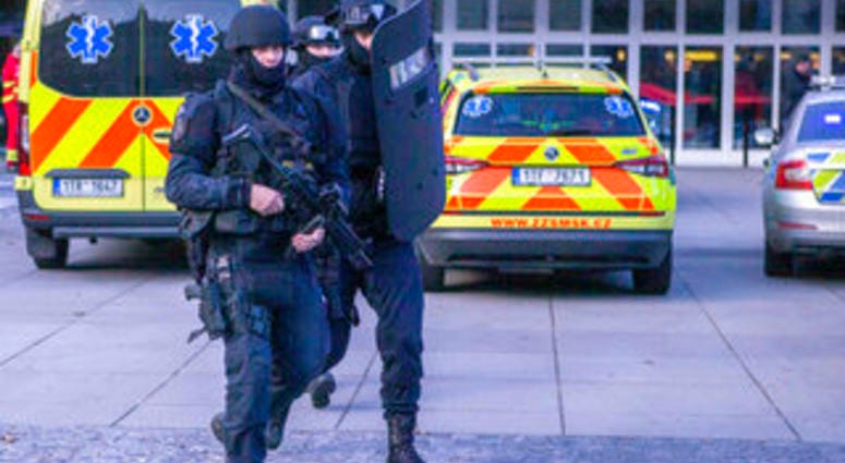 Police personnel outside the Ostrava Teaching Hospital after a shooting incident in Ostrava, Czech Republic, Tuesday, Dec. 10, 2019. (Vladimir Prycek/CTK via AP) Police personnel outside the Ostrava Teaching Hospital after a shooting incident in Ostrava, Czech Republic, Tuesday, Dec. 10, 2019. (Vladimir Prycek/CTK via AP)
