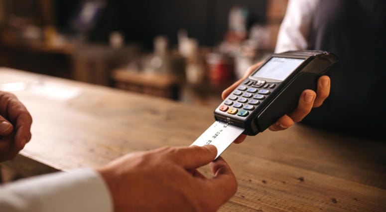 Credit cards in a wallet on wooden table