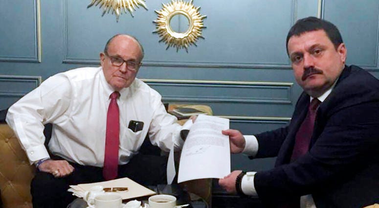 In this handout photo provided by Adriii Derkach's press office, Rudy Giuliani, an attorney for U.S President Donald Trump, left, meets with Ukrainian lawmaker Adriii Derkach in Kyiv, Ukraine, Thursday, Dec. 5, 2019. (Adriii Derkach's press office via AP) In this handout photo provided by Adriii Derkach's press office, Rudy Giuliani, an attorney for U.S President Donald Trump, left, meets with Ukrainian lawmaker Adriii Derkach in Kyiv, Ukraine, Thursday, Dec. 5, 2019. (Adriii Derkach's press office via AP)