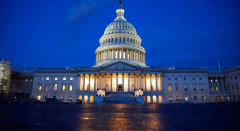 FILE - In this Dec. 4, 2019, file photo, fight shines on the U.S. Capitol dome in Washington. (AP Photo/Patrick Semansky, File) FILE - In this Dec. 4, 2019, file photo, fight shines on the U.S. Capitol dome in Washington. (AP Photo/Patrick Semansky, File)