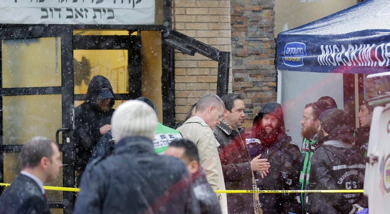 Jersey City's mayor Steven Fulop, center right, talks with first responders at the scene of a shooting in Jersey City, N.J., Dec. 11, 2019. Fulop says gunmen targeted a kosher market during a shooting that killed multiple people. (AP Photo/Seth Wenig) Jersey City's mayor Steven Fulop, center right, talks with first responders at the scene of a shooting in Jersey City, N.J., Dec. 11, 2019. Fulop says gunmen targeted a kosher market during a shooting that killed multiple people. (AP Photo/Seth Wenig)