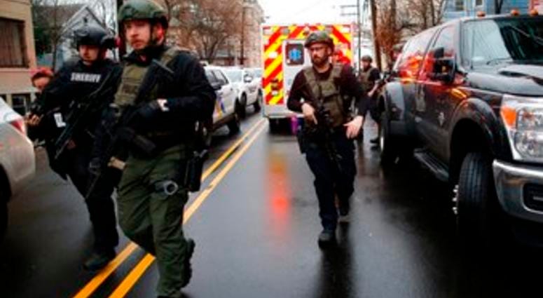 Law enforcement arrives at the scene following reports of gunfire, Tuesday, Dec. 10, 2019, in Jersey City, N.J. (AP Photo/Eduardo Munoz Alvarez) Law enforcement arrives at the scene following reports of gunfire, Tuesday, Dec. 10, 2019, in Jersey City, N.J. (AP Photo/Eduardo Munoz Alvarez)