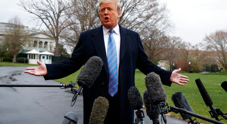 President Donald Trump speaks with reporters before boarding Marine One on the South Lawn of the White House, Friday, April 5, 2019, in Washington. (AP Photo/Evan Vucci)
