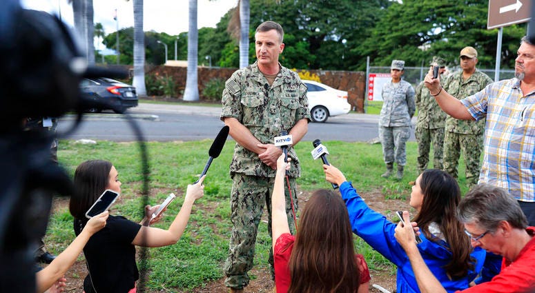 U.S. Navy Rear Adm. Robb Chadwick speaks to the media at the main gate at Joint Base Pearl Harbor-Hickam, Wednesday, Dec. 4, 2019, in Hawaii, following a shooting. (AP Photo/Marco Garcia) U.S. Navy Rear Adm. Robb Chadwick speaks to the media at the main gate at Joint Base Pearl Harbor-Hickam, Wednesday, Dec. 4, 2019, in Hawaii, following a shooting. (AP Photo/Marco Garcia)