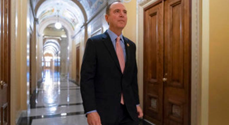 Rep. Adam Schiff, chairman of the House Intelligence Committee, walks to a secure area at the Capitol to interview a witness in the House impeachment inquiry. (AP Photo/J. Scott Applewhite)