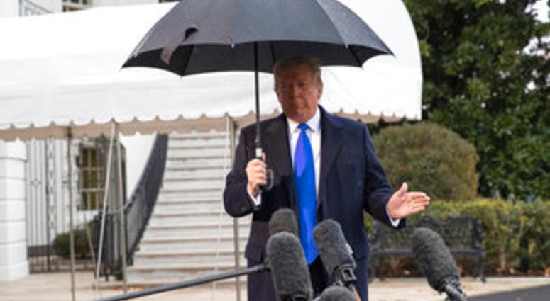 President Donald Trump speaks with reporters on the South Lawn of the White House before departing, Monday, Dec. 2, 2019, in Washington. (AP Photo/Alex Brandon) President Donald Trump speaks with reporters on the South Lawn of the White House before departing, Monday, Dec. 2, 2019, in Washington. (AP Photo/Alex Brandon)