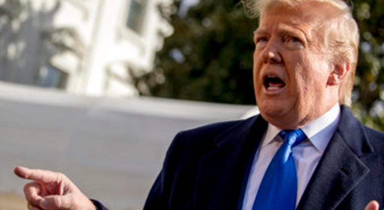 President Donald Trump speaks to reporters on the South Lawn of the White House in Washington, Friday, Nov. 8, 2019. (AP Photo/Andrew Harnik)