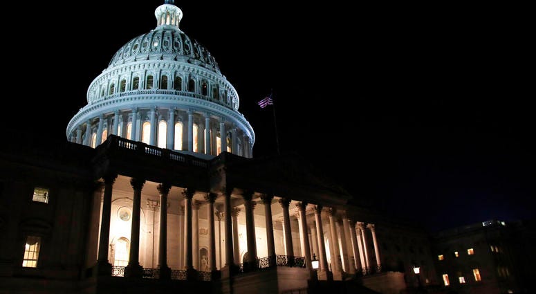 FILE- In this Feb. 5, 2019, file photo lights illuminate the U.S. Capitol dome in Washington. On Thursday, Feb. 14, the Labor Department reports on the number of people who applied for unemployment benefits last week. (AP Photo/Manuel Balce Ceneta, File)