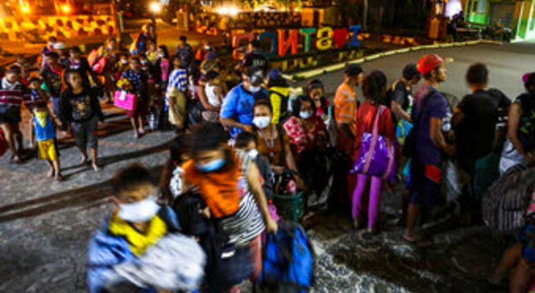 Residents are evacuated to a local school as the Taal volcano continues to erupt in Santo Tomas, Batangas, southern Philippines, Monday January 13, 2020. (AP Photo/Gerrard Carreon) Residents are evacuated to a local school as the Taal volcano continues to erupt in Santo Tomas, Batangas, southern Philippines, Monday January 13, 2020. (AP Photo/Gerrard Carreon)