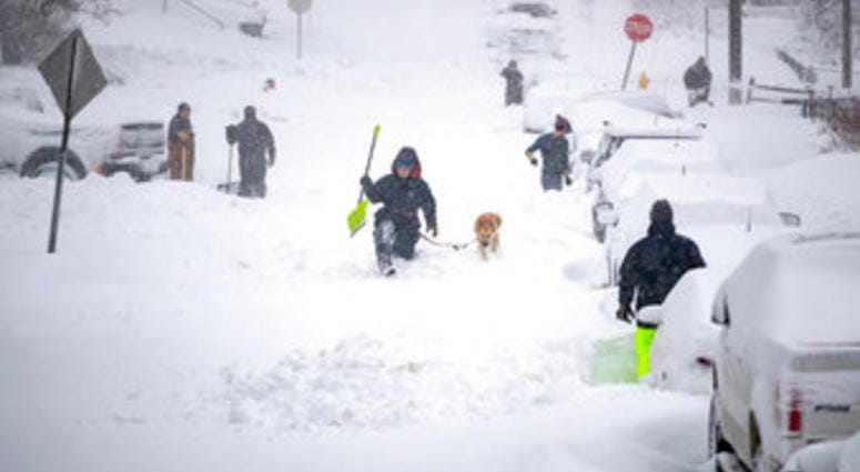 Neighbors work together in an effort to clear out as much snow as possible from E. 8th Street, Sunday, Dec. 1, 2019, in Duluth, Minn. (Alex Kormann/Star Tribune via AP) Neighbors work together in an effort to clear out as much snow as possible from E. 8th Street, Sunday, Dec. 1, 2019, in Duluth, Minn. (Alex Kormann/Star Tribune via AP)
