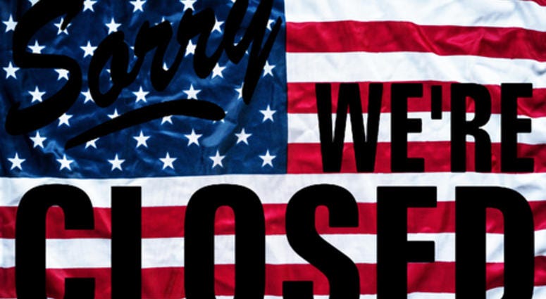 Government shutdown represented by a sorry we`re closed sign outline with american flag background