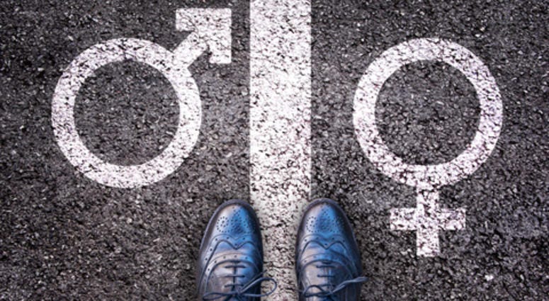 Legs with gender symbol on asphalt, gender concept