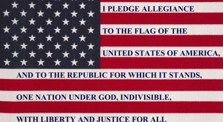 The pledge of allegiance written on the United States of America flag