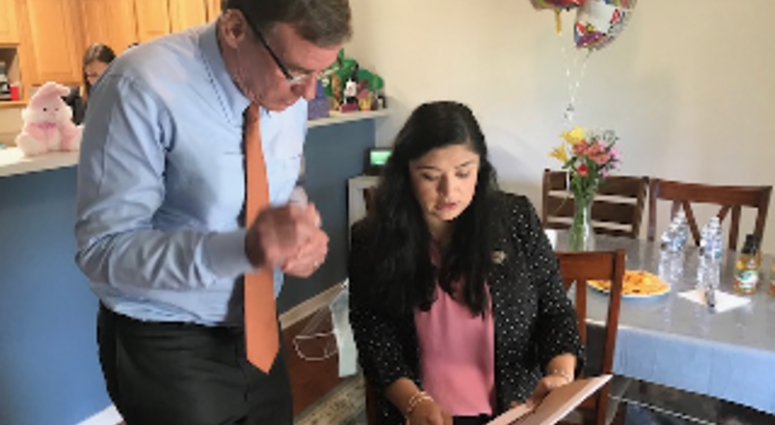 Senator Mark Warner meets with Patricia Santos at her home on Fort Lee on April 25, 2019. (Wayne Covil, WTVR, pool)