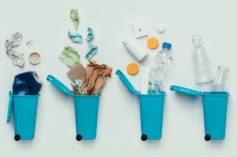 top view of trash bins and assorted garbage isolated on grey, recycle concept top view of trash bins and assorted garbage isolated on grey, recycle concept