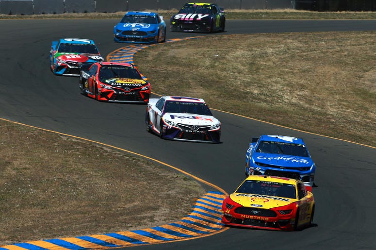 cars drag racing on track