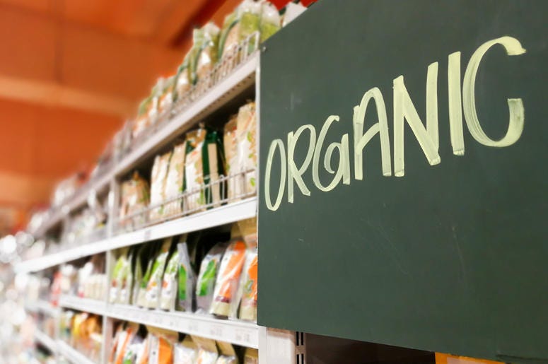 Organic food signage on modern supermarket grocery aisle Organic food signage on modern supermarket grocery aisle