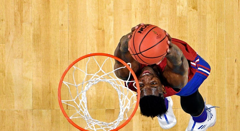 Mar 30, 2018; San Antonio, TX, USA; Kansas Jayhawks forward Silvio De Sousa (22) dunks the ball during practice before the Final Four of the 2018 NCAA Tournament at Alamodome. Mandatory Credit: Bob Donnan-USA TODAY Sports