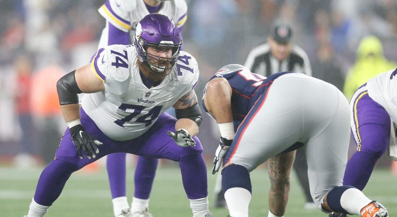 Dec 2, 2018; Foxborough, MA, USA; Minnesota Vikings tackle Mike Remmers (74) at the line of scrimmage during the third quarter against the New England Patriots at Gillette Stadium. Mandatory Credit: Greg M. Cooper-USA TODAY Sports MIke Remmers