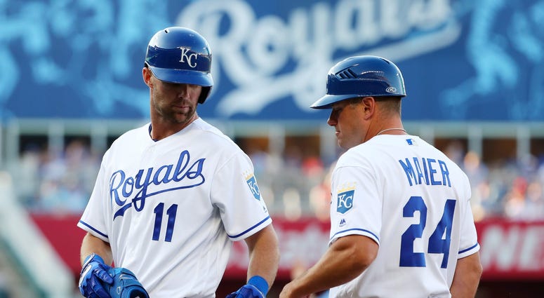 Jul 13, 2019; Kansas City, MO, USA; Kansas City Royals center fielder Bubba Starling (11) celebrates with first base coach Mitch Maier (24) after hitting an RBI single for his first major league hit during the fifth inning against the Detroit Tigers at Ka Mitch Maier