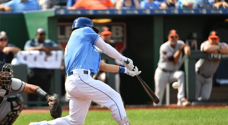 Sep 1, 2019; Kansas City, MO, USA; Kansas City Royals left fielder Alex Gordon (4) hits a one run double in the seventh inning against the Baltimore Orioles at Kauffman Stadium. Mandatory Credit: Denny Medley-USA TODAY Sports Alex Gordon