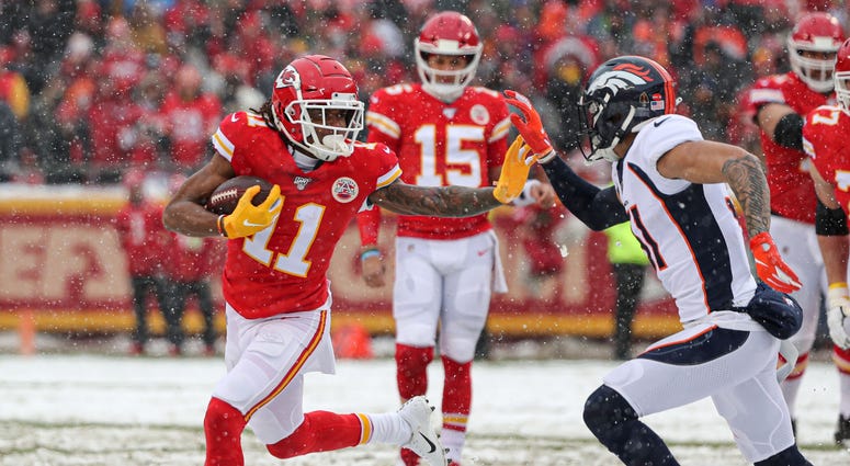 Dec 15, 2019; Kansas City, MO, USA; Kansas City Chiefs wide receiver Demarcus Robinson (11) stiff arms Denver Broncos free safety Justin Simmons (31) during the first half at Arrowhead Stadium. Mandatory Credit: Jay Biggerstaff-USA TODAY Sports Demarcus Robinson