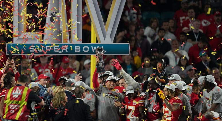 Feb 2, 2020; Miami Gardens, Florida, USA; Kansas City Chiefs quarterback Patrick Mahomes (15) hoist the Vince Lombardi Trophy after defeating the San Francisco 49ers in Super Bowl LIV at Hard Rock Stadium. Mandatory Credit: Kyle Terada-USA TODAY Sports Kansas City Chiefs