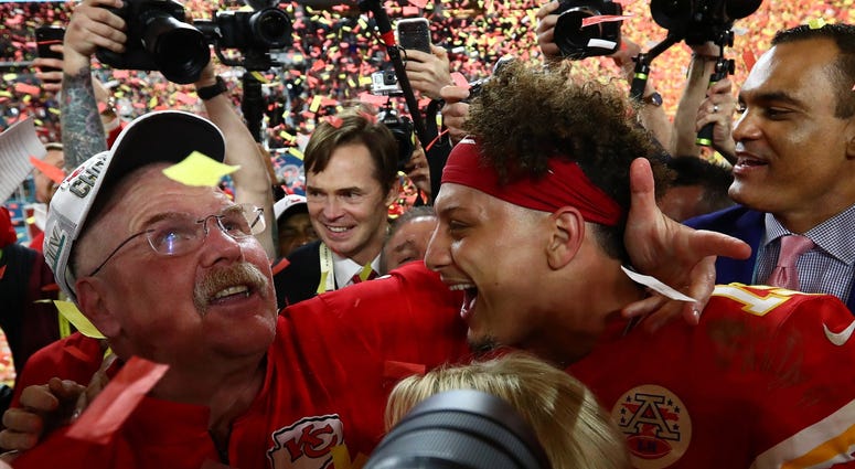 Feb 2, 2020; Miami Gardens, Florida, USA; Kansas City Chiefs head coach Andy Reid celebrates with quarterback Patrick Mahomes (15) after a victory against the San Francisco 49ers in Super Bowl LIV at Hard Rock Stadium. Mandatory Credit: Matthew Emmons-USA Andy Reid and Patrick Mahomes