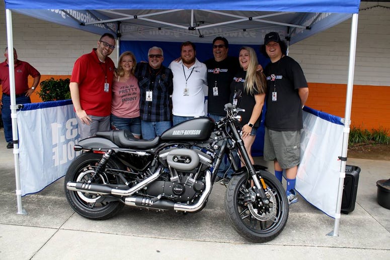 The Wolf's Smokin' Harley winner with The Wolf airstaff The Wolf's Smokin' Harley winner with The Wolf airstaff
